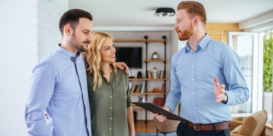 A couple meeting a property manager